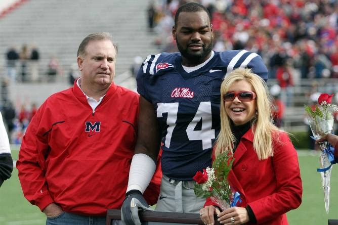 Michael Oher with Sean and Leigh Anne Tuohy