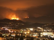 A fire on a hillside above town near Los Angeles