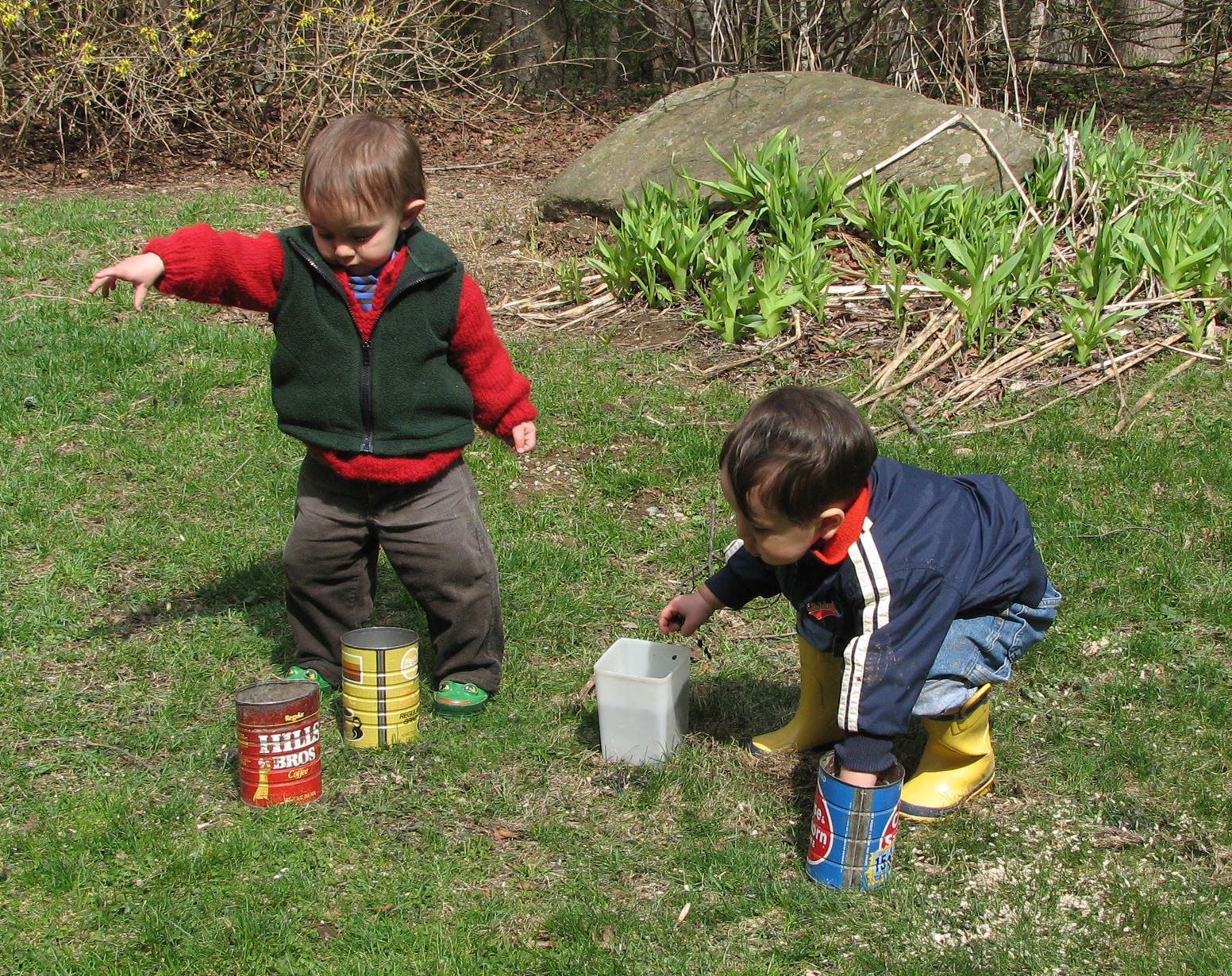 Small humans helping birds in spring