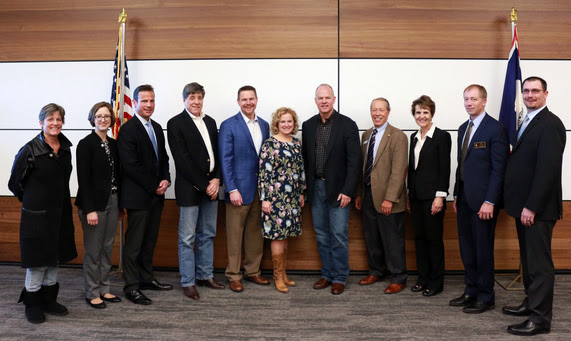 State Superintendent Jillian Balow stands with Governor Matt Mead and other education stakeholders following the signing of his executive order.