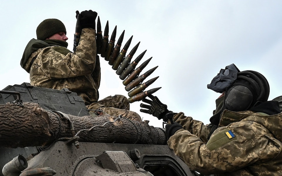 Ukrainian service members load ammunition in Zaporizhzhia Region