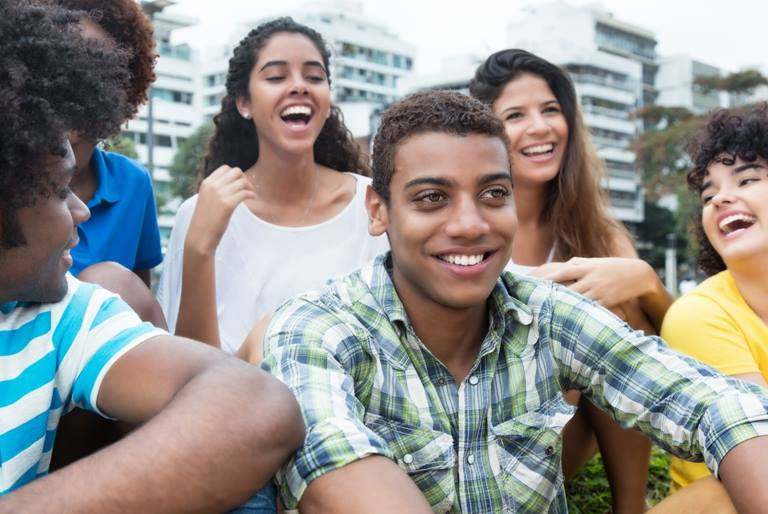 group of smiling teenage students