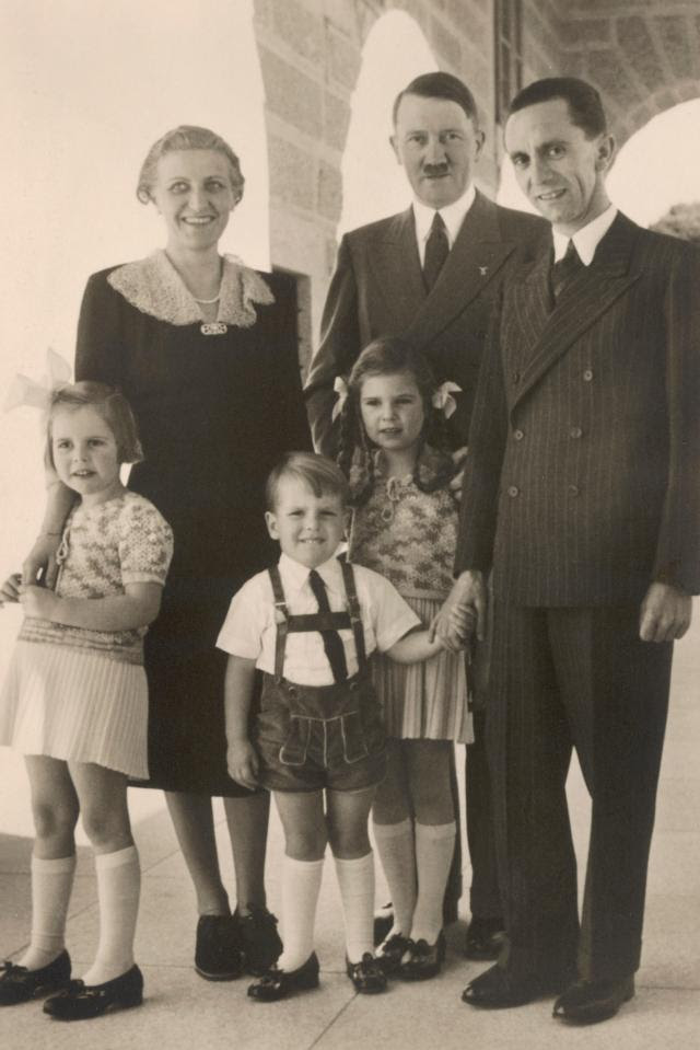 Goebbels with his wife, Magda, three of their six children, and the Führer in the 1930s