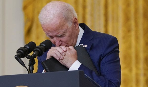 President Joe Biden pauses as he listens to a question about the bombings at the Kabul airport that killed at least 12 U.S. service members, from the East Room of the White House, Thursday, Aug. 26, 2021, in Washington. (AP Photo/Evan Vucci)