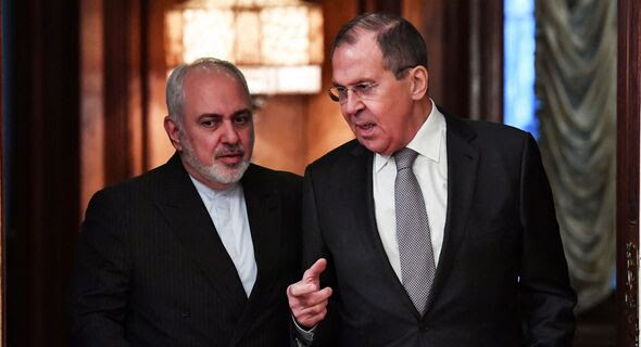 Russian Foreign Minister Sergey Lavrov (R) meets with Iranian Foreign Minister Mohammad Javad Zarif in Moscow on Dec. 30, 2019. The two met again in Tehran, Iran, on April 13, 2021.