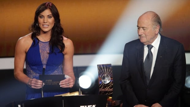 Former U.S. goalkeeper Hope Solo, left, alleges former FIFA president Sepp Blatter, right, grabbed her buttocks while the pair were on stage at this Ballon d'Or gala in 2013.