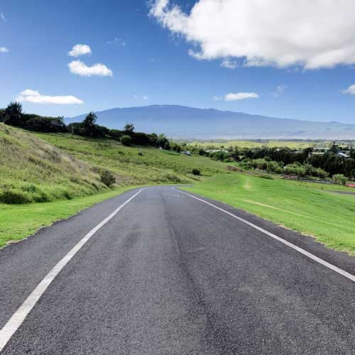 A clear day on Hawaiʻi Island. Mauna Kea can be seen in the distance while on a drive through Waimea. 