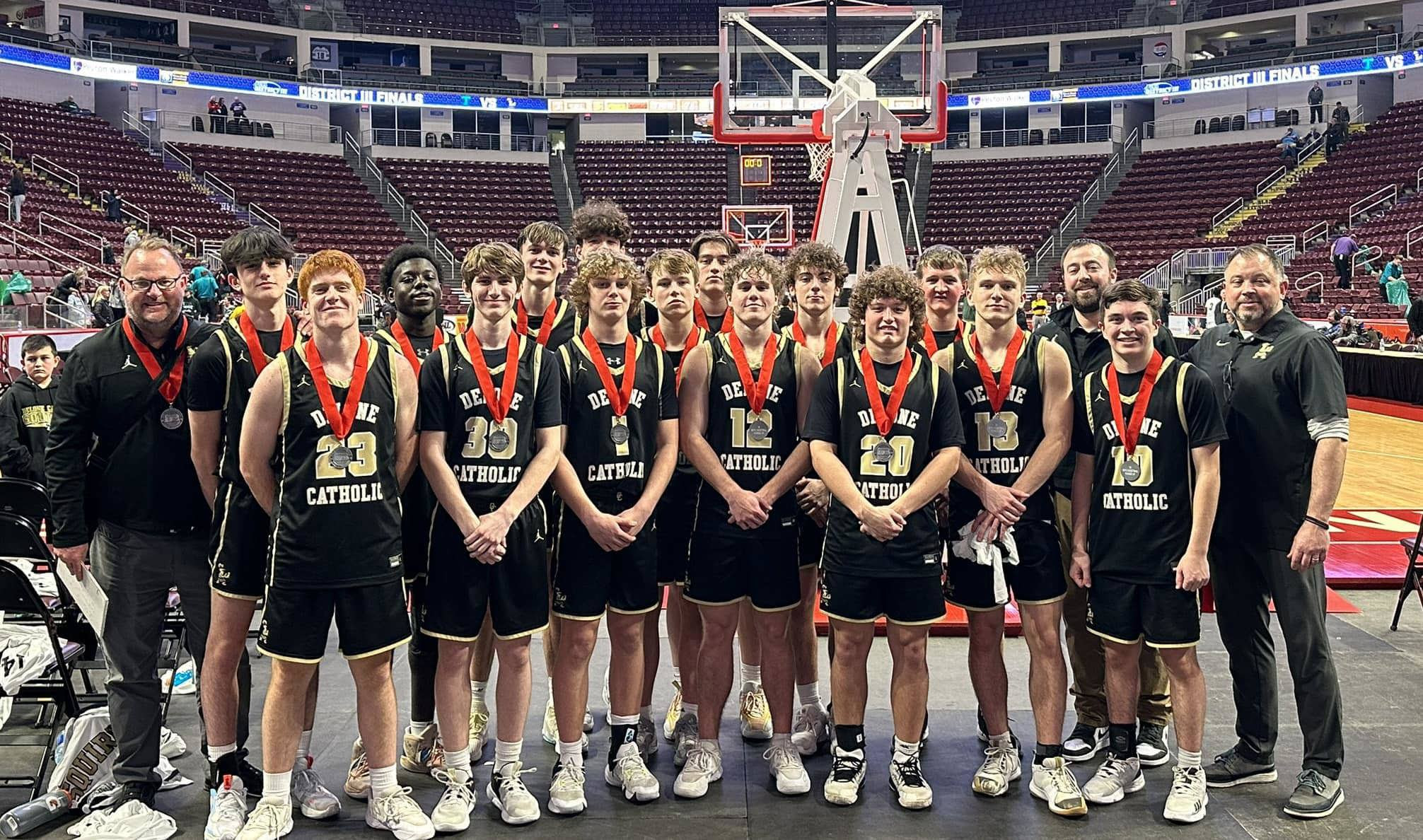 Boys' basketball team with District 3 silver medals