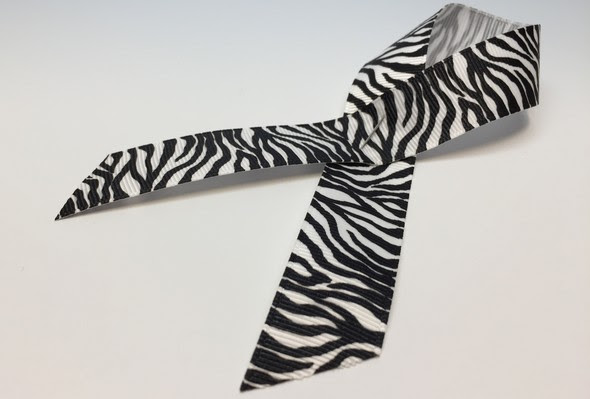 Zebra-print ribbon, a symbol for awareness of primary immunodeficiencies and other rare diseases
