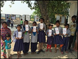 The figure above is a photograph showing children holding vaccination records during a rubella vaccination activity in the Uttarakhand state of India in 2017.