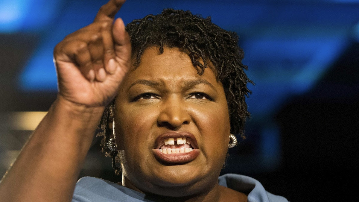 Abrams Slammed For Being Maskless Next To Masked Children: ‘This Photo Is Catastrophic’ For Democrats