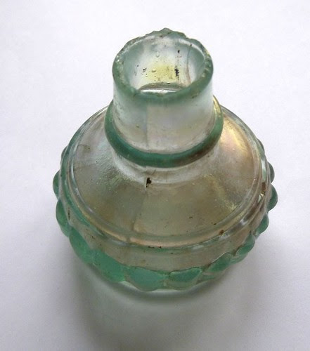 Bottle top, perhaps from an ink or medicine bottle?
