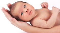 newborn being held