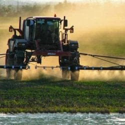 large farmer spraying crops can be used for dicamba articles
