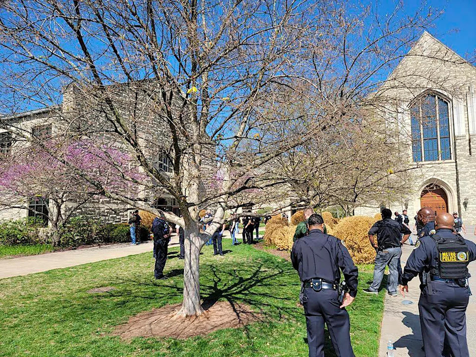 This photo provided by the Metro Nashville Police Department shows officers at an active shooter event that took place at Covenant School, Covenant Presbyterian Church, in Nashville, Tenn. Monday, March 27, 2023. Authorities say the suspect in a shooting at a private Christian school in Nashville is dead. (Metro Nashville Police Department via AP)