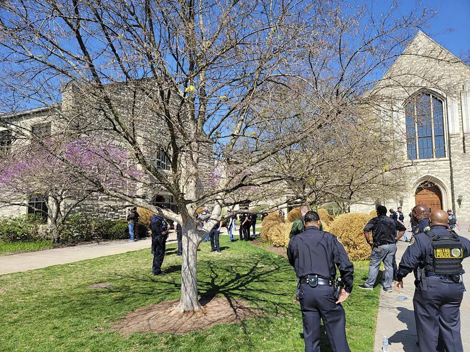 This photo provided by the Metro Nashville Police Department shows officers at an active shooter event that took place at Covenant School, Covenant Presbyterian Church, in Nashville, Tenn. Monday, March 27, 2023. Authorities say the suspect in a shooting at a private Christian school in Nashville is dead. (Metro Nashville Police Department via AP)