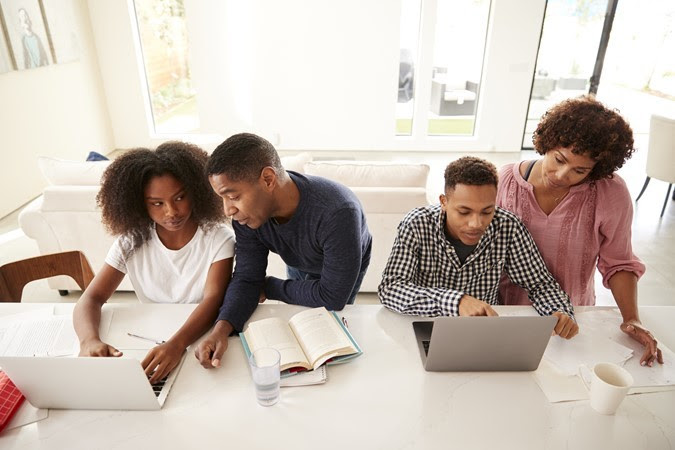 black parents helping black teen children