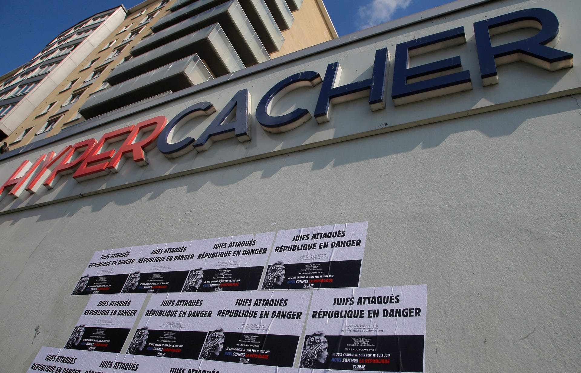 Posters on a wall of a kosher supermarket attacked by jihadist gunmen in 2015 reads, 'Jews attacked, Republic in danger,' in Paris, France, September 2, 2020.