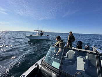 conservation officers in marine patrol boat
