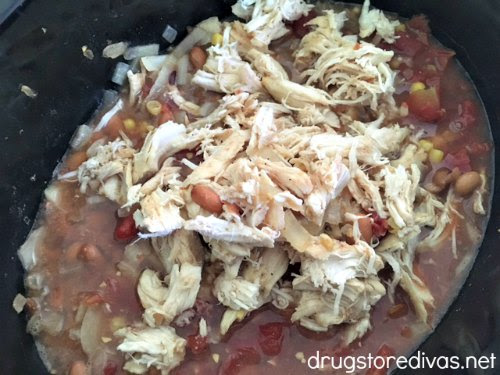 Slow Cooker Chicken Burrito Bowl ingredients in a slow cooker.