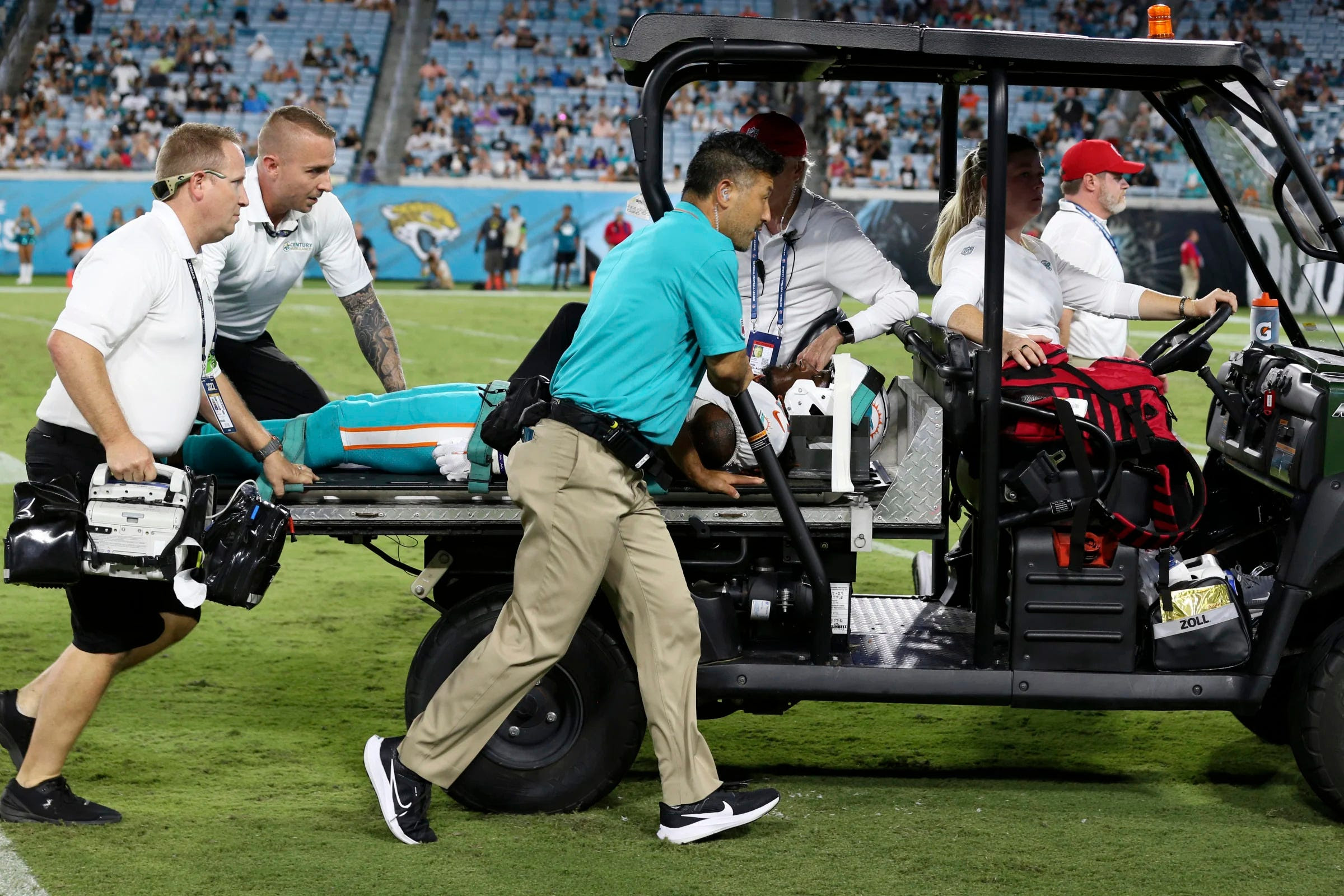 Miami Dolphins wide receiver Daewood Davis is carted off the field during the second half of an NFL preseason football game against the Jacksonville Jaguars, Saturday, Aug. 26, 2023, in Jacksonville, Fla. (AP Photo/Gary McCullough)