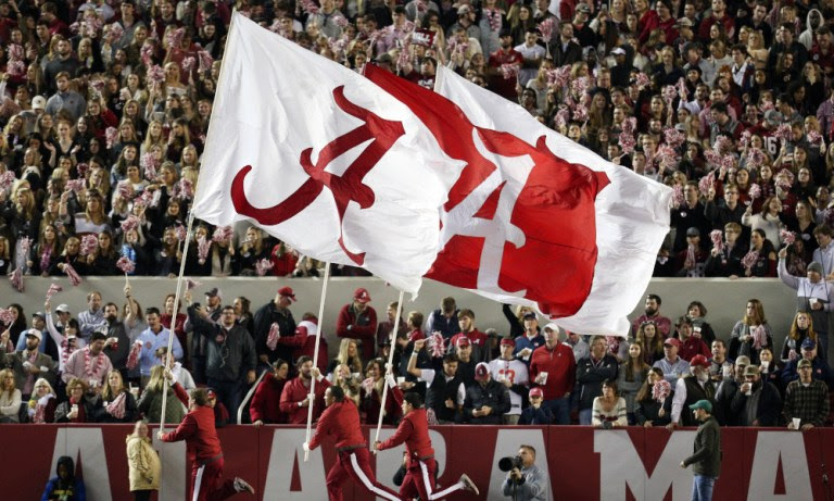 Alabama flags waving at Bryant-Denny Stadium